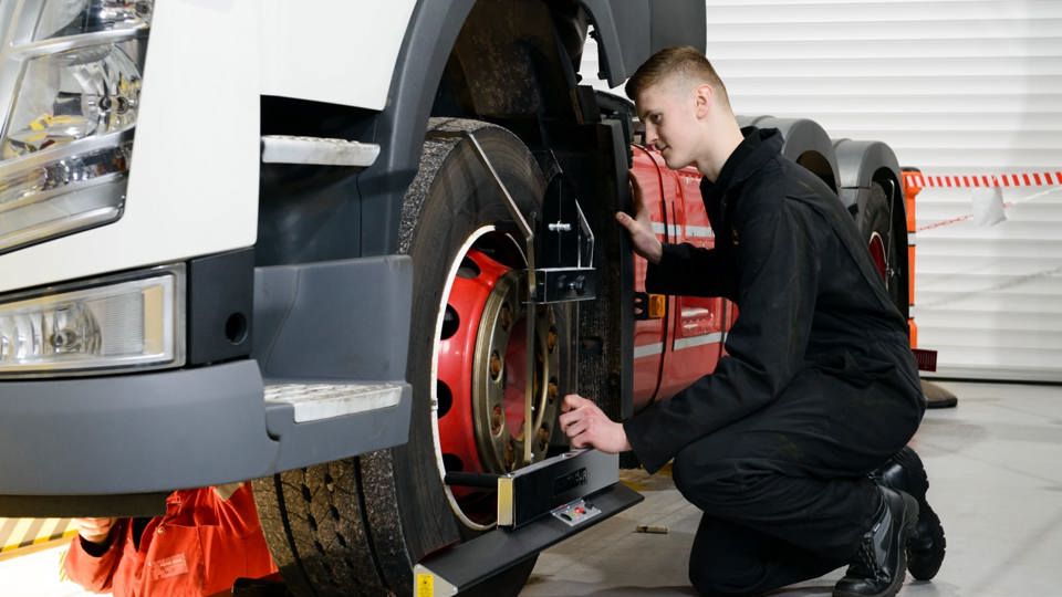 Apprentice inspecting LGV tyre 