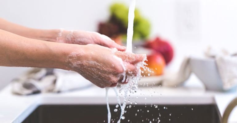 washing hands in sink