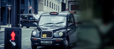 Black cab in city street