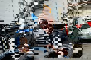 female apprentice checking a tyre