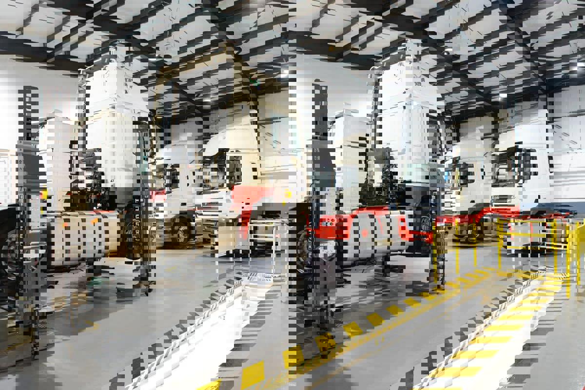 4 HGV's on ramps in the Kilbirnie Street workshop