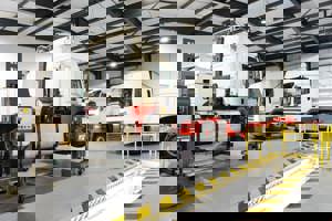 4 HGV's on ramps in the Kilbirnie Street workshop