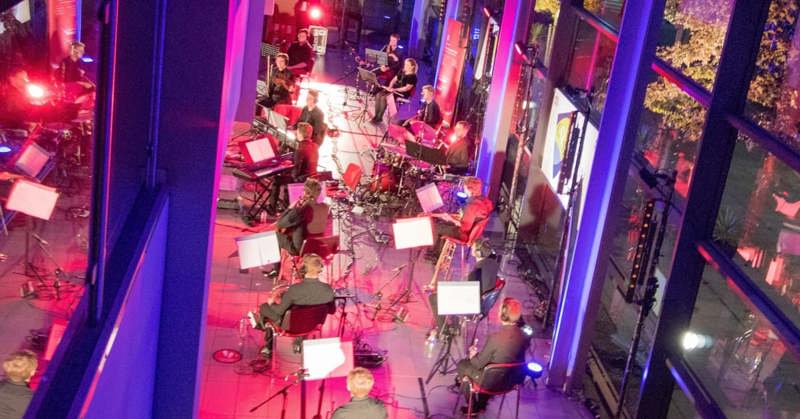 Orchestra playing inside GTGs Glasgow facility